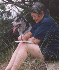 Annie sketching on the dunes